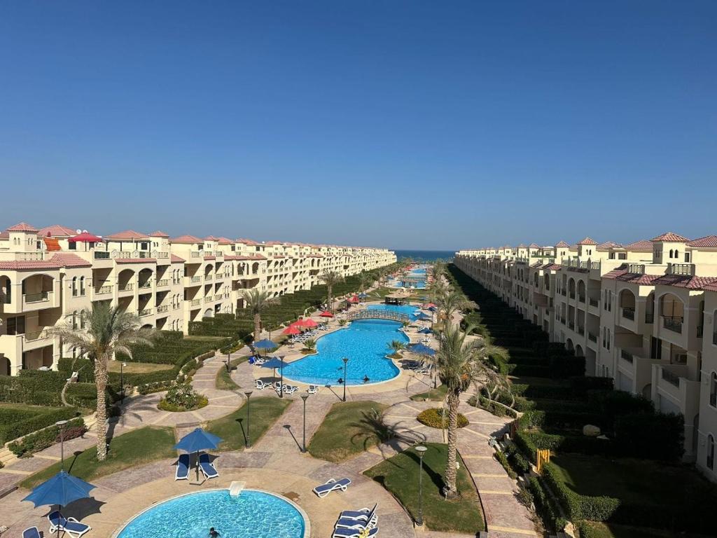 an aerial view of a resort with two pools at La Sirena Palm Families only in Ain Sokhna