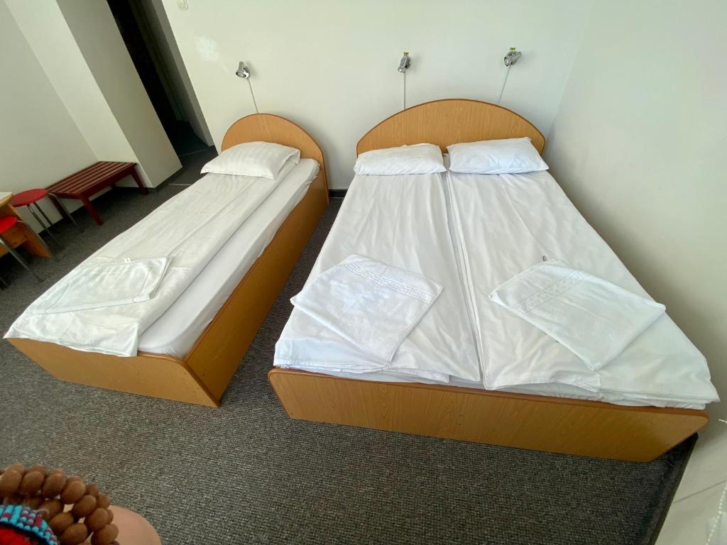 Postel nebo postele na pokoji v ubytování Vila Onix