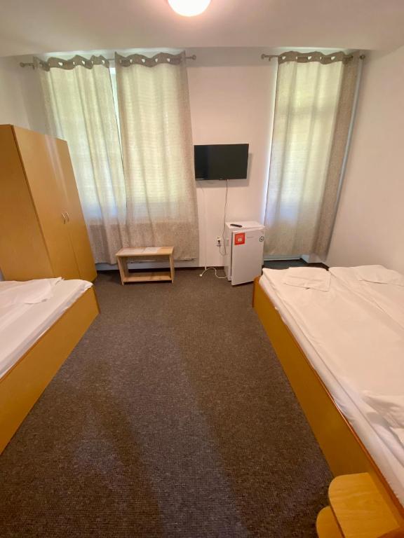 Postel nebo postele na pokoji v ubytování Vila Onix