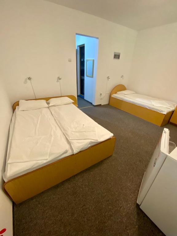 Postel nebo postele na pokoji v ubytování Vila Onix