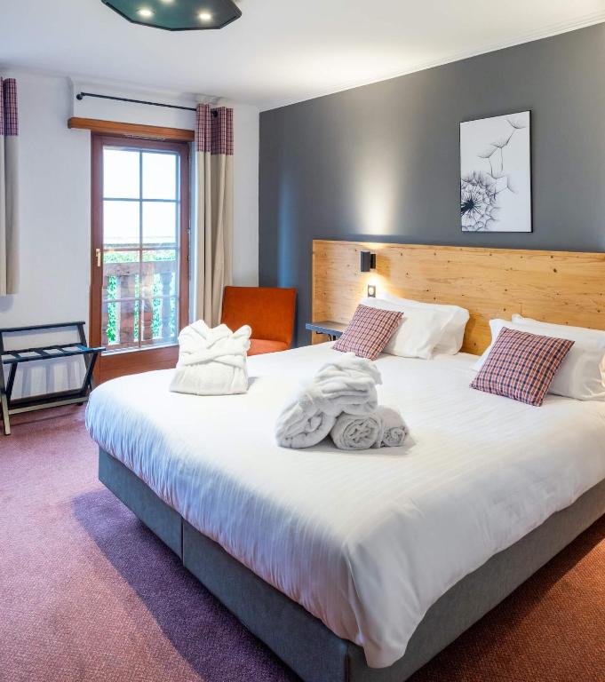 Postel nebo postele na pokoji v ubytování Hôtel au Heimbach