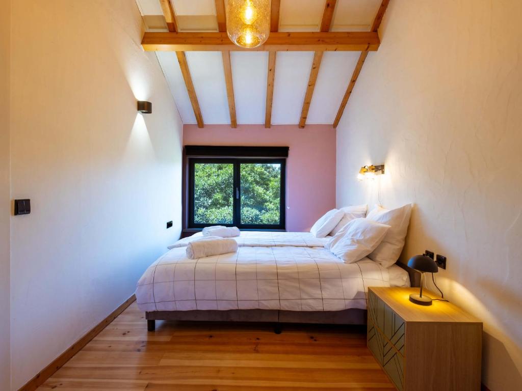 Uma cama ou camas num quarto em Quinta Japonesa