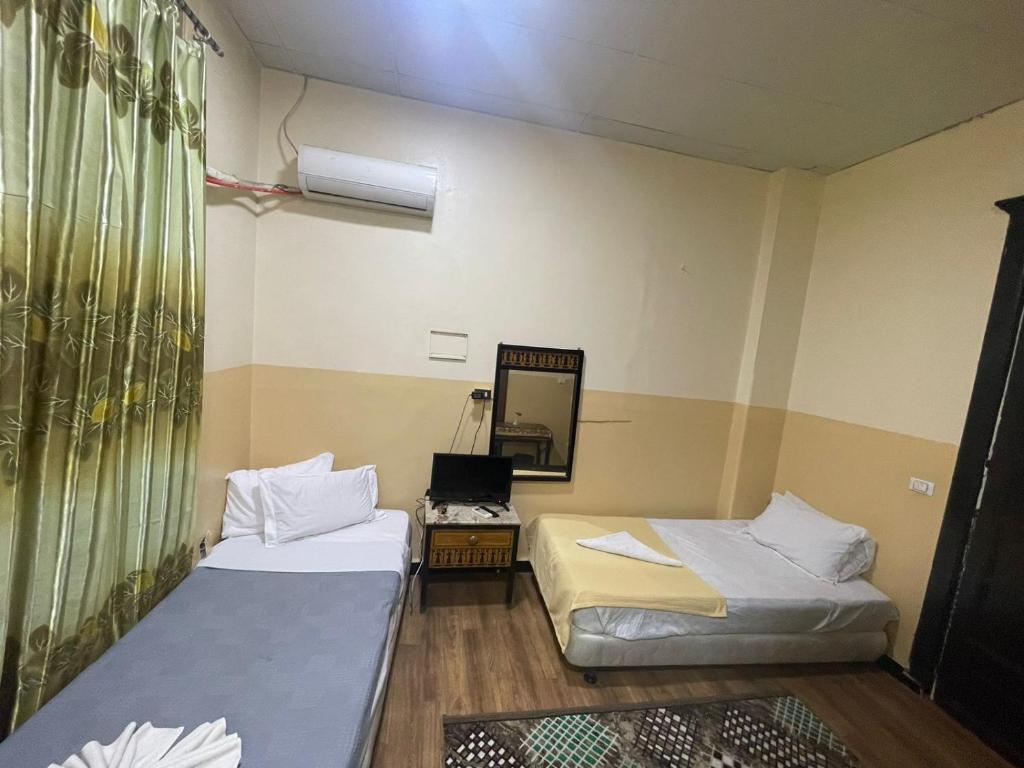 Postel nebo postele na pokoji v ubytování One Season Hotel