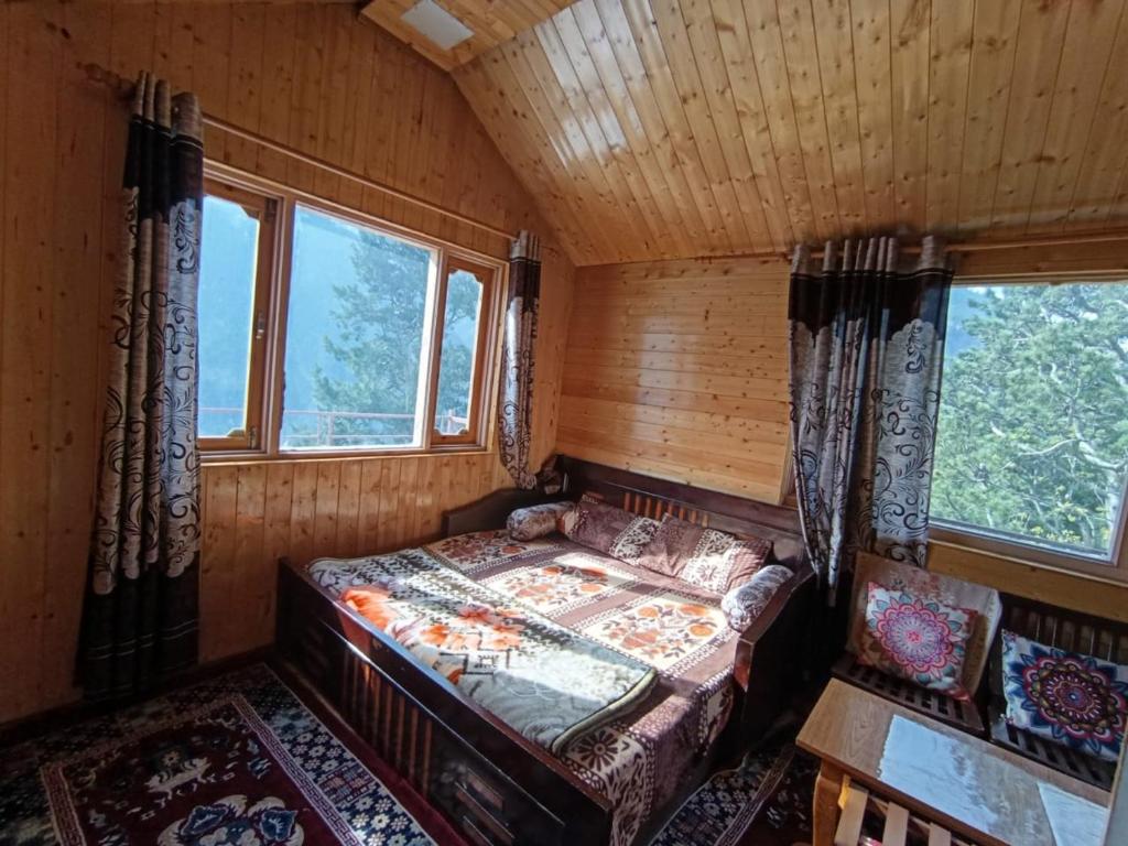 Postel nebo postele na pokoji v ubytování The Shudarang Inn
