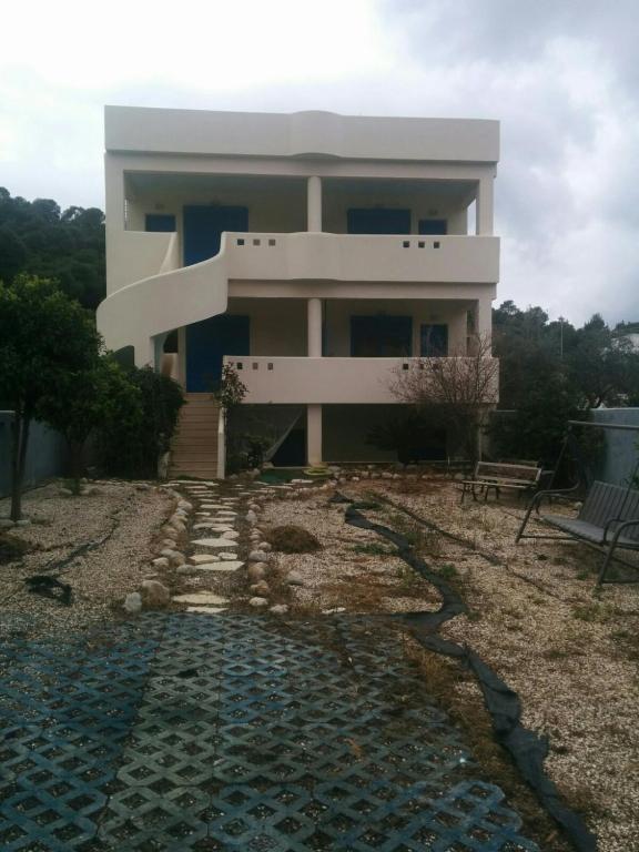 a house on a hill with a stone path in front of it at Angel in Káto Alepokhórion