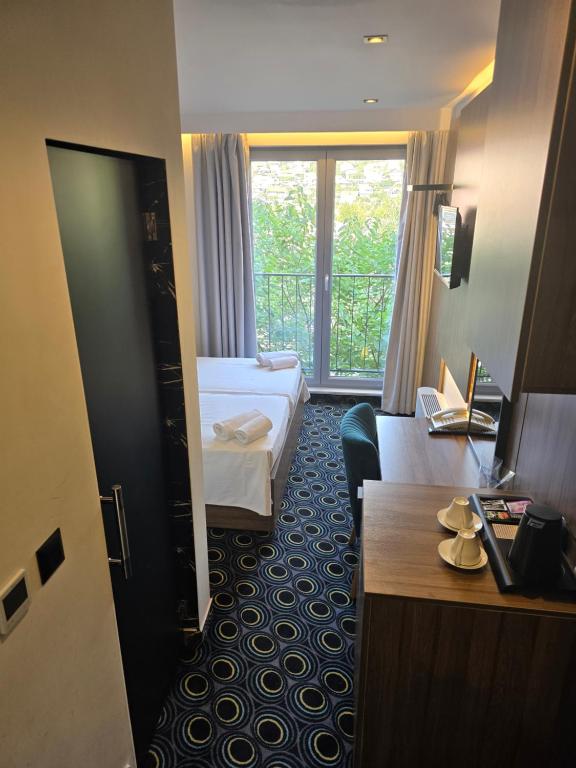 Postel nebo postele na pokoji v ubytování Hotel Carpe Diem
