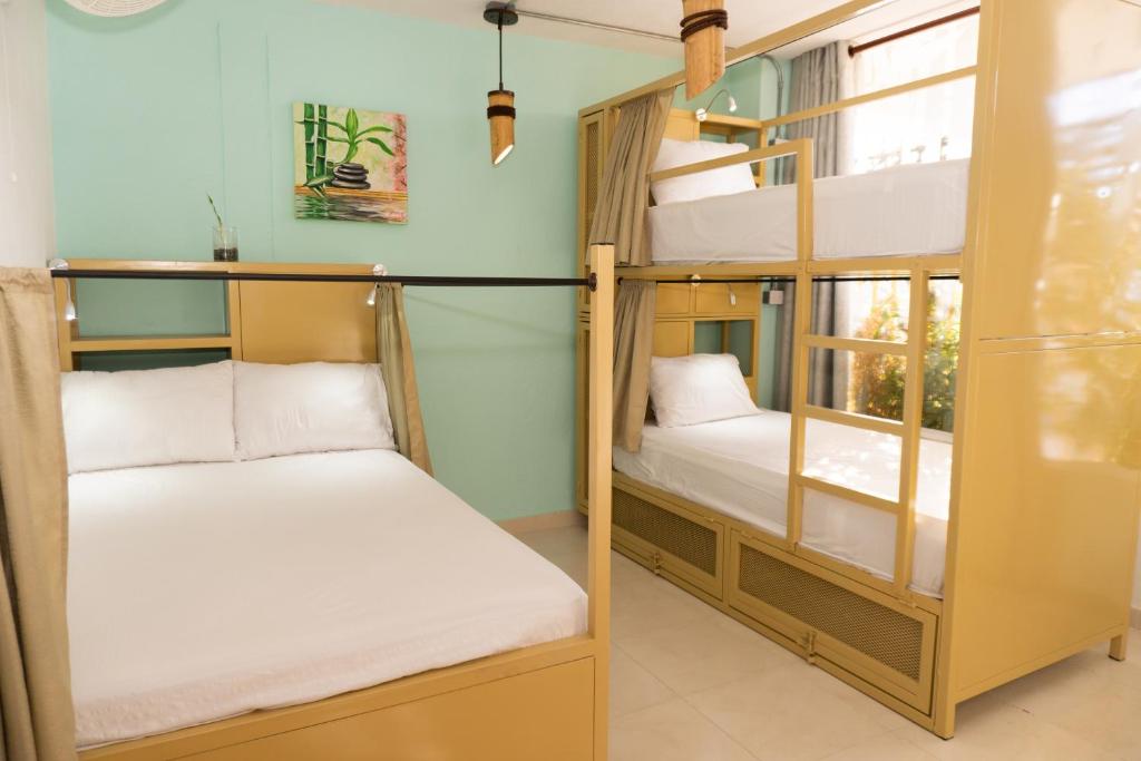 Postel nebo postele na pokoji v ubytování Hostal Las Guaduas
