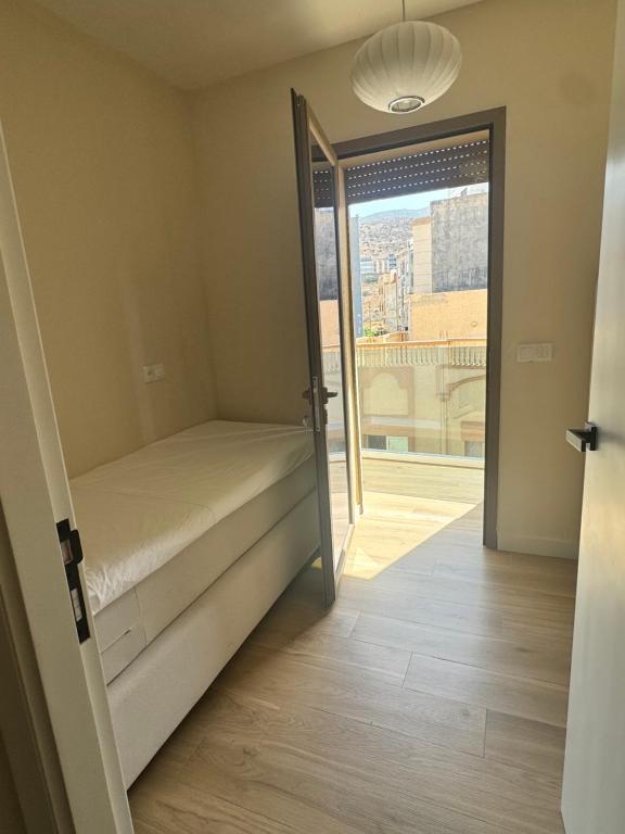 Postel nebo postele na pokoji v ubytování belle vue appartement al hoceima