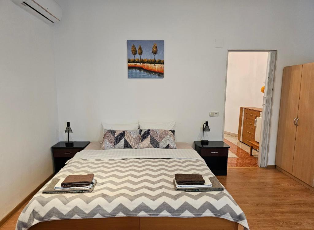 Postel nebo postele na pokoji v ubytování Apartmani Royal Residence