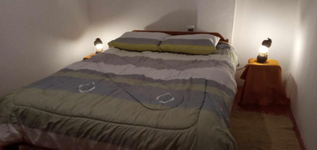 Postel nebo postele na pokoji v ubytování Wayqi Wasi