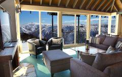a living room with a view of a mountain at Gotcha in Mount Hotham