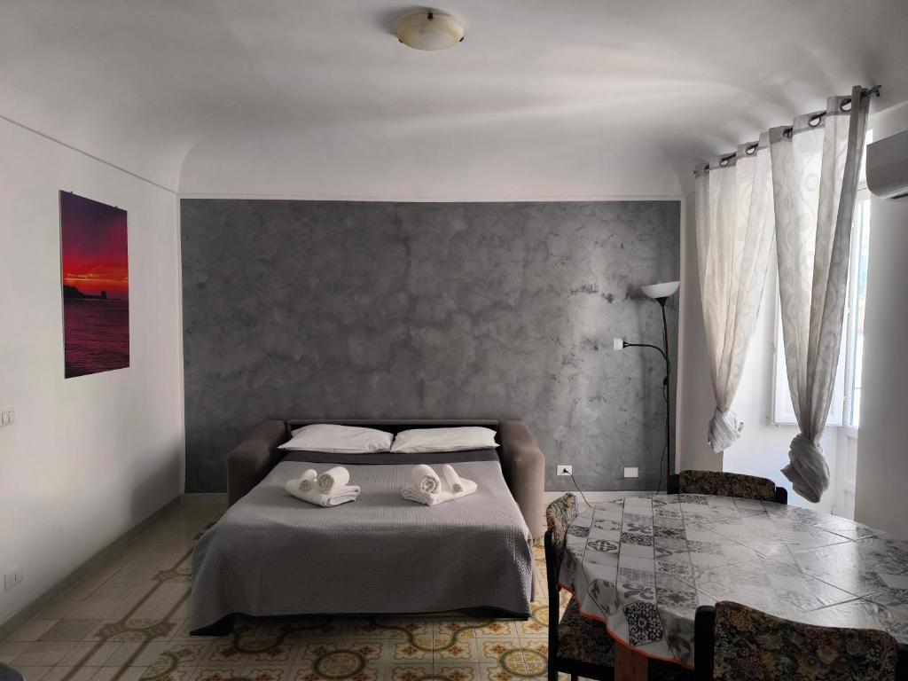 Łóżko lub łóżka w pokoju w obiekcie Casa di Nick