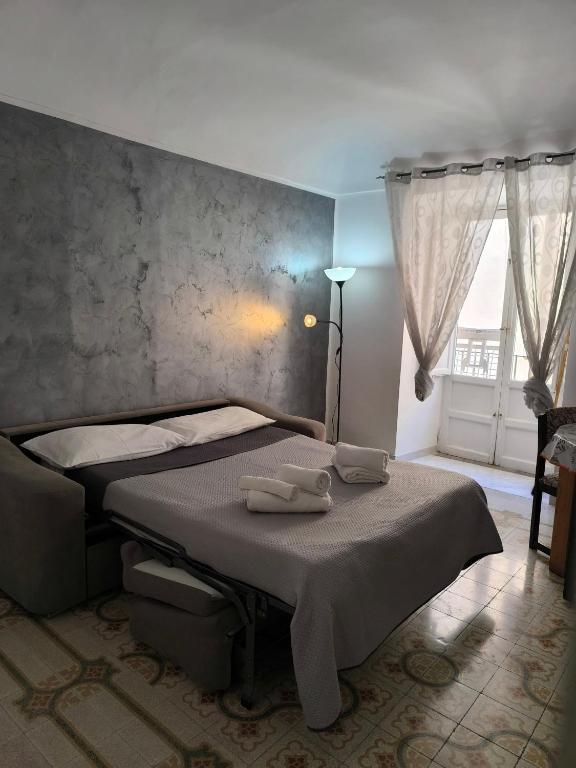 Łóżko lub łóżka w pokoju w obiekcie Casa di Nick
