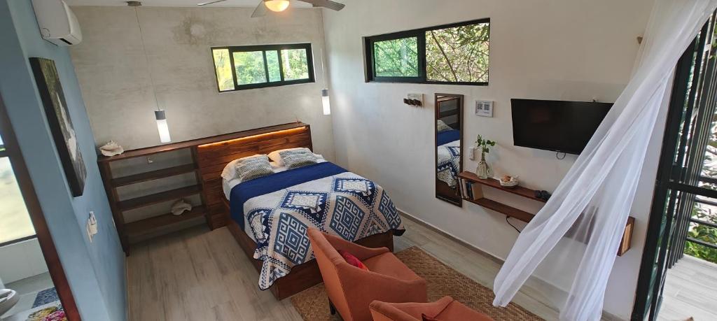 Postel nebo postele na pokoji v ubytování Tu Departamento en Mahahual