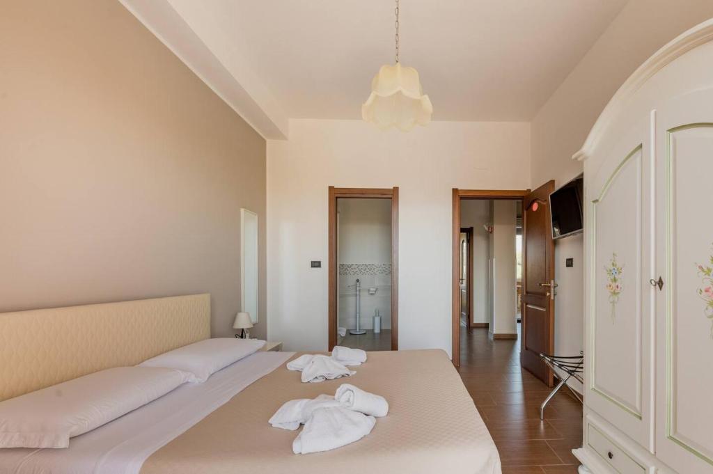 Postel nebo postele na pokoji v ubytování Panoramic Rooms