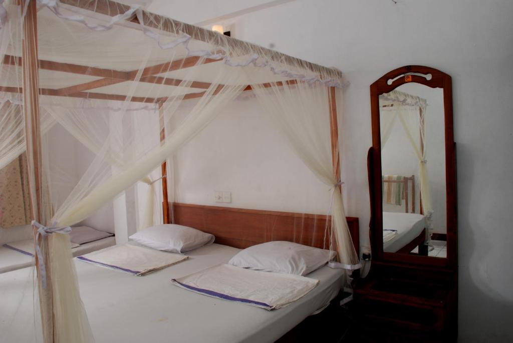Postel nebo postele na pokoji v ubytování Hansa Surf Hotel