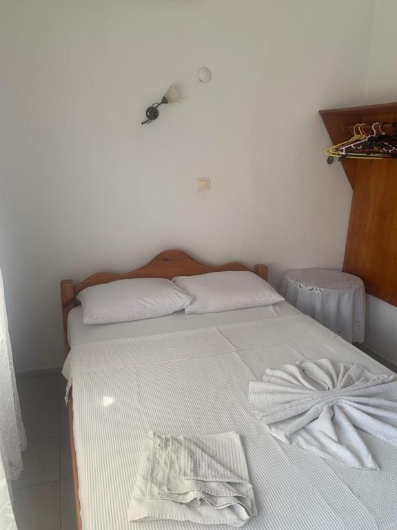 Postel nebo postele na pokoji v ubytování Kristal pansiyon