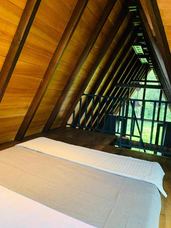 Postel nebo postele na pokoji v ubytování Cannelle Hill Cabanas