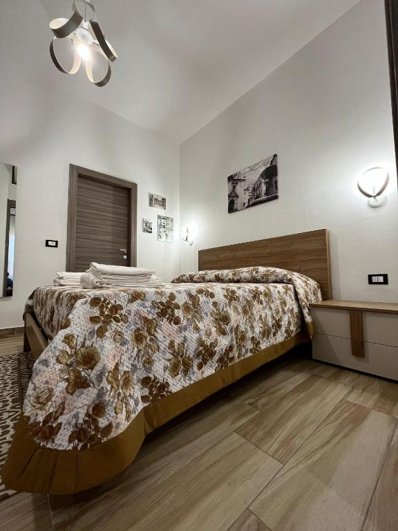 Postel nebo postele na pokoji v ubytování B&B Paola City