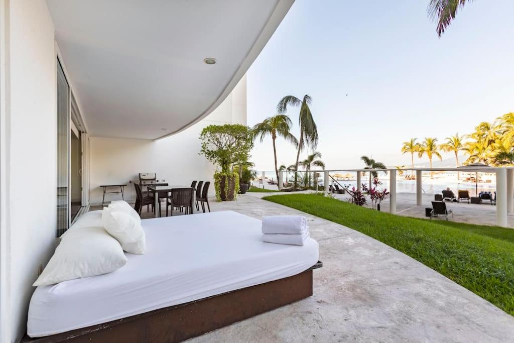 Postel nebo postele na pokoji v ubytování DEPARTAMENTO FRENTE A PLAYA EN NUEVO VALLARTA