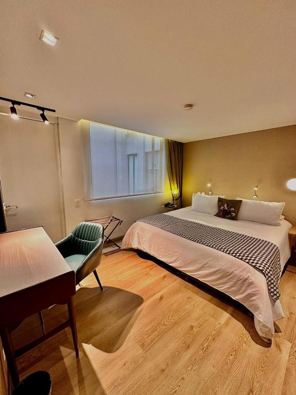 Postel nebo postele na pokoji v ubytování Hotel Regina