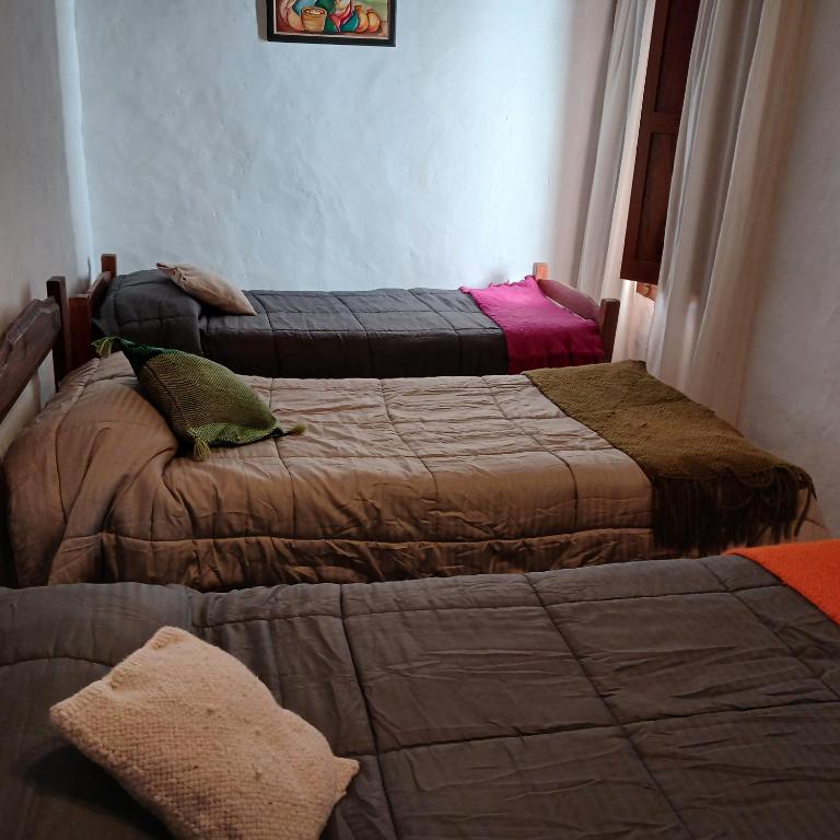 Postel nebo postele na pokoji v ubytování Cabañas Loma de El Pelao