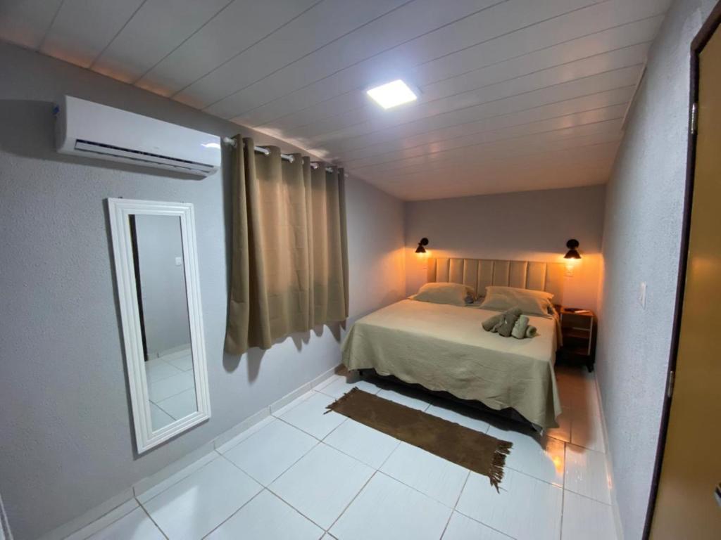 En eller flere senge i et værelse på Pousada Casa Berna