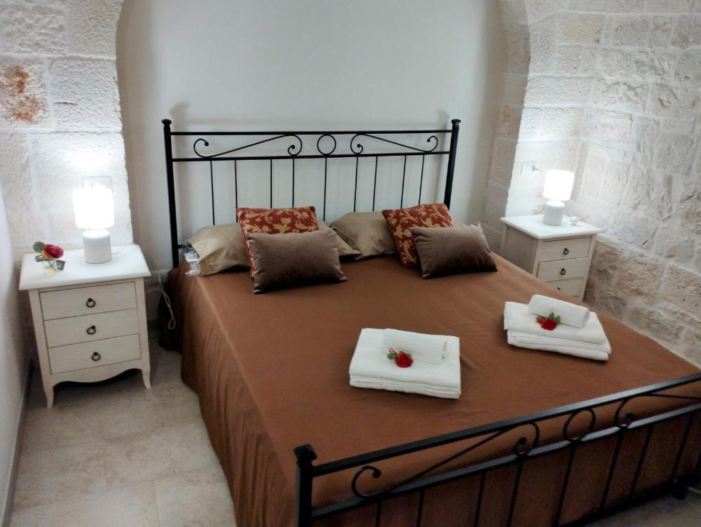 Ένα ή περισσότερα κρεβάτια σε δωμάτιο στο Trulli La Quercia del Nonno