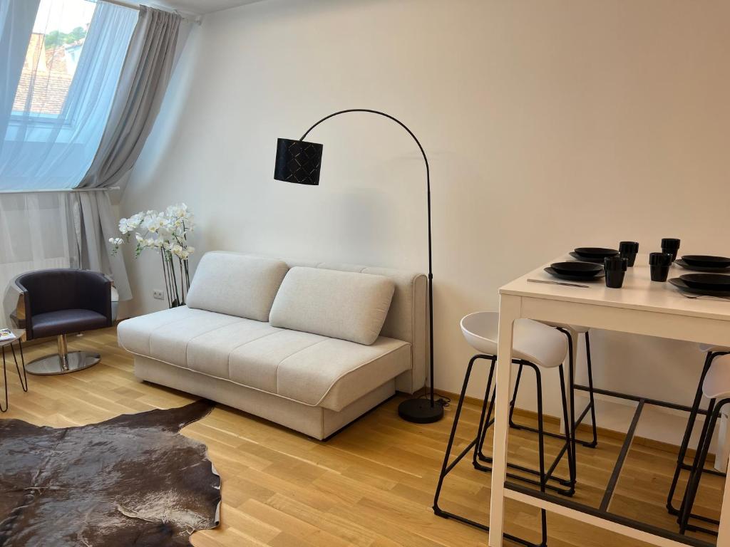 Un lugar para sentarse en "Home-Suite-Home" im historischen Zentrum von Hartberg