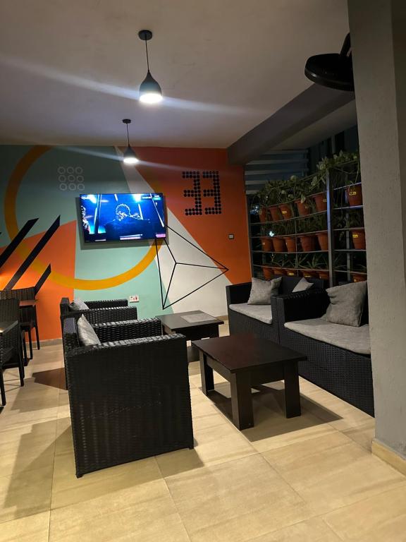 TV a/nebo společenská místnost v ubytování Villa Thirty Three