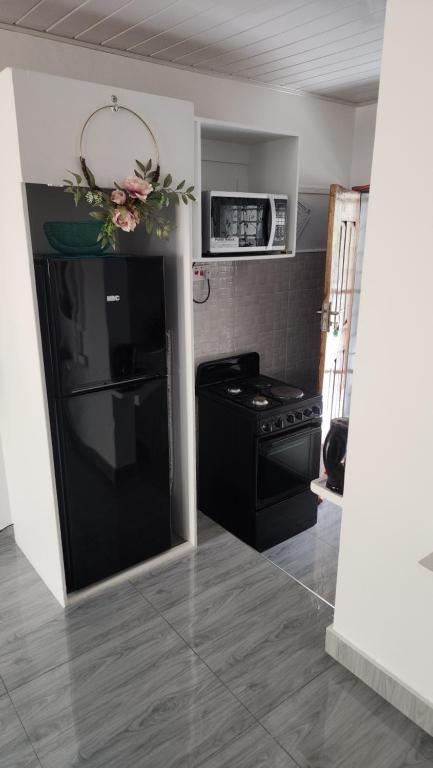 Kuchyň nebo kuchyňský kout v ubytování Ticia Apartment, Chipata