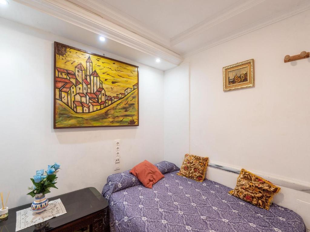 A bed or beds in a room at Belvilla by OYO Casa San SebastiÃ¡n de los Reyes