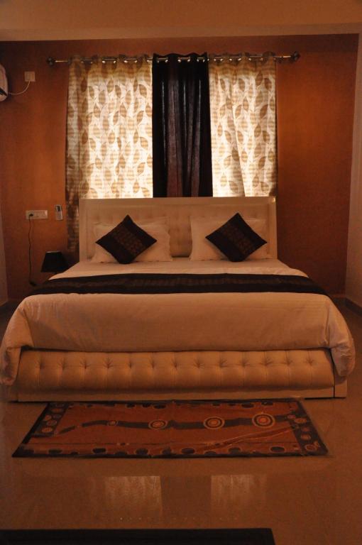 Postel nebo postele na pokoji v ubytování Hotel Dewa Goa