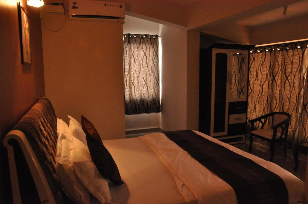 Postel nebo postele na pokoji v ubytování Hotel Dewa Goa