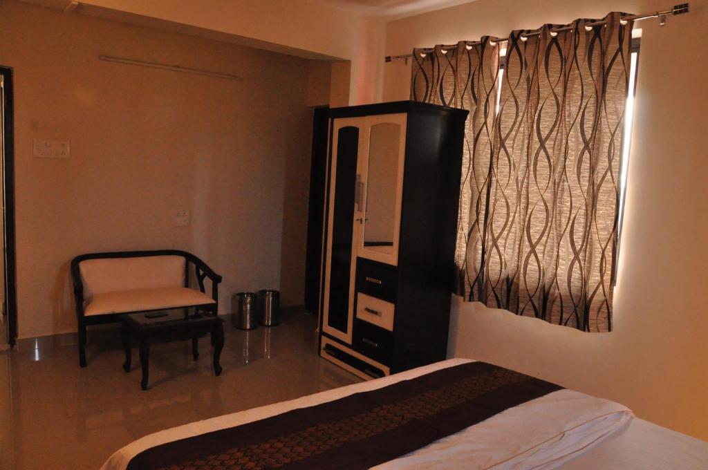 Postel nebo postele na pokoji v ubytování Hotel Dewa Goa