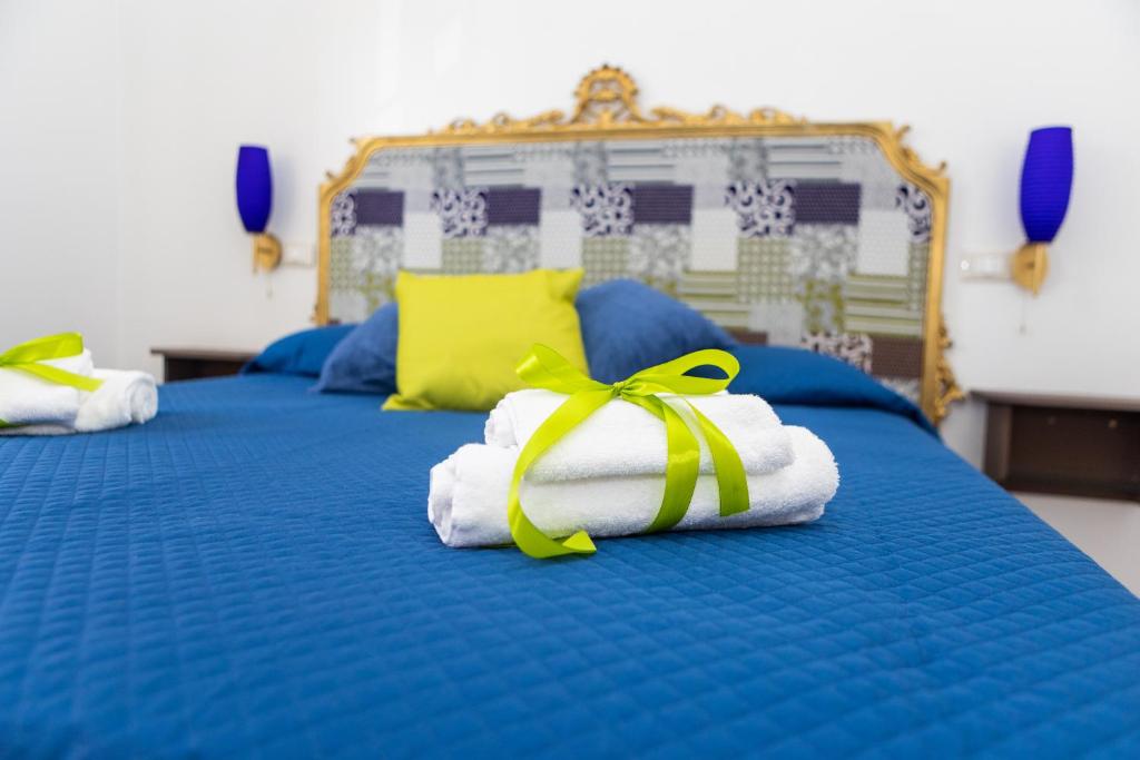 Letto o letti in una camera di Ai Mercati di Palermo