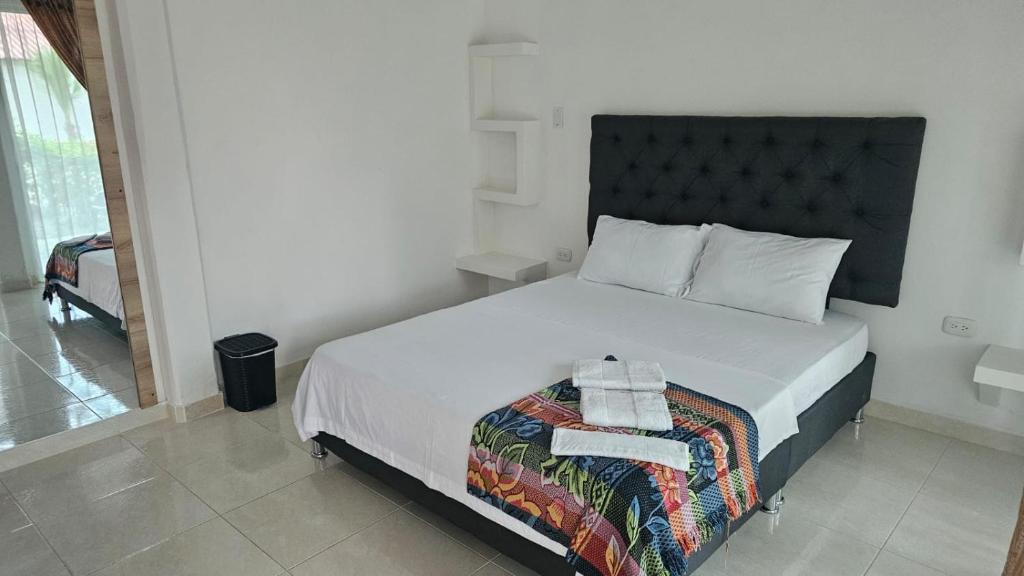Voodi või voodid majutusasutuse Hotel - Rancho JJ toas