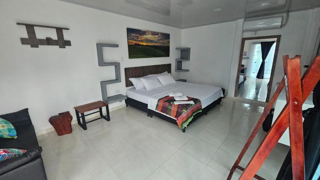 Voodi või voodid majutusasutuse Hotel - Rancho JJ toas