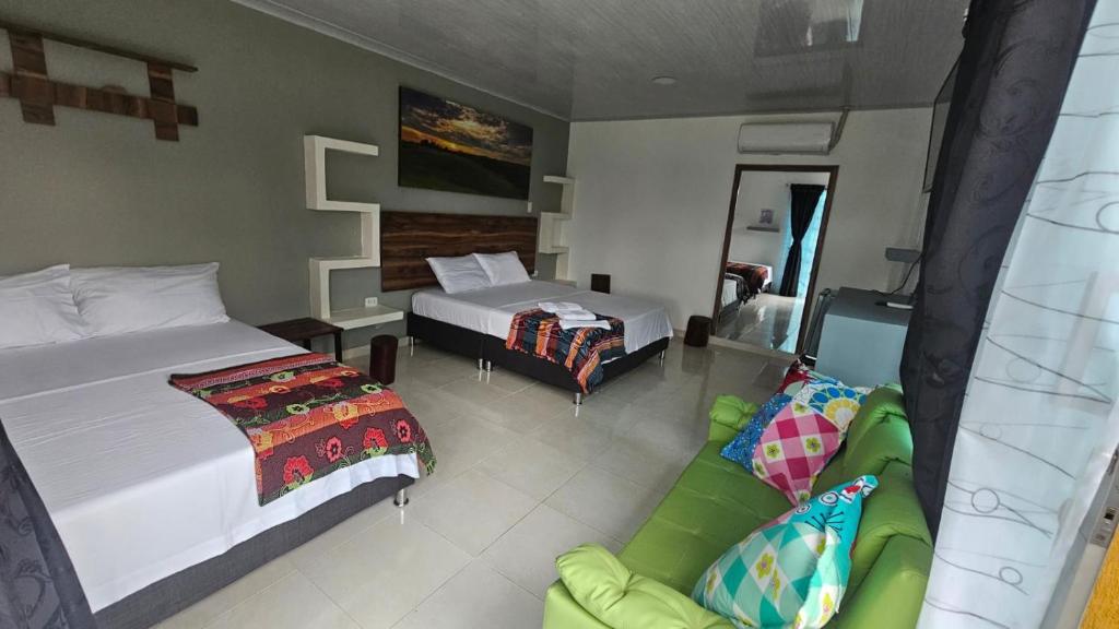 Voodi või voodid majutusasutuse Hotel - Rancho JJ toas