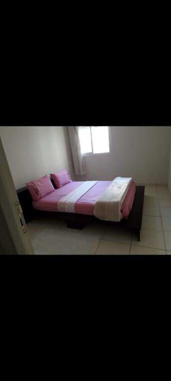 Ένα ή περισσότερα κρεβάτια σε δωμάτιο στο Appartement à tabriquet salé
