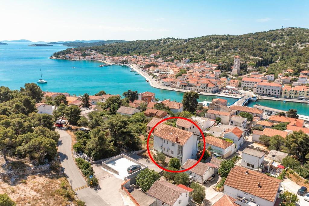 an aerial view of a house with a red circle at Apartment Tisno 4295a in Tisno