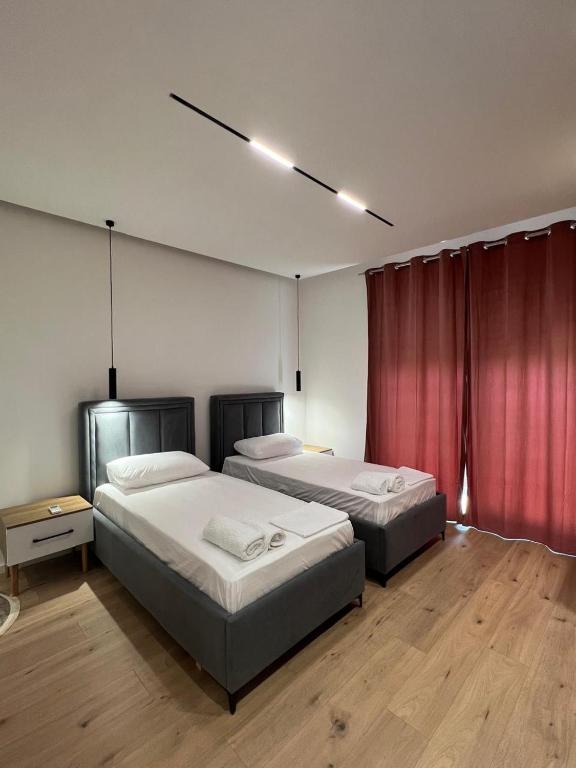 Postel nebo postele na pokoji v ubytování Vlora Sunset Rooms