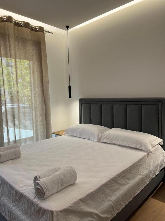 Postel nebo postele na pokoji v ubytování Vlora Sunset Rooms