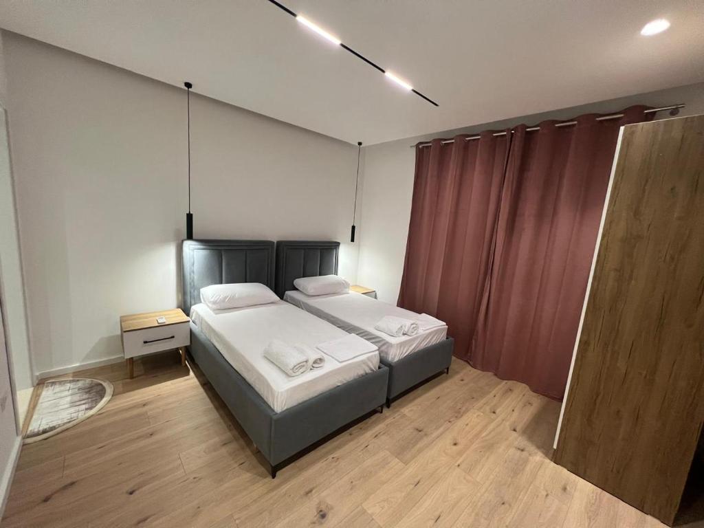 Postel nebo postele na pokoji v ubytování Vlora Sunset Rooms