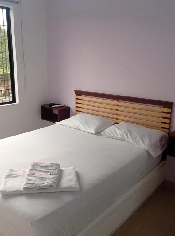 Postel nebo postele na pokoji v ubytování Hotel ZT
