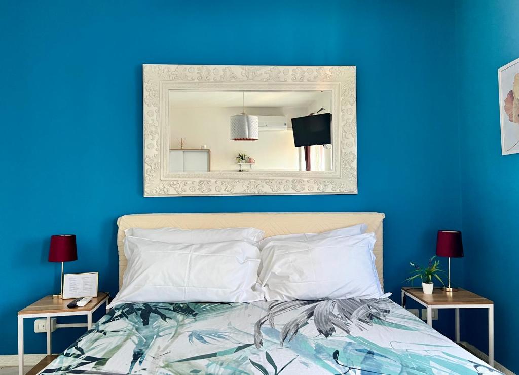 Postel nebo postele na pokoji v ubytování Verona Rooms