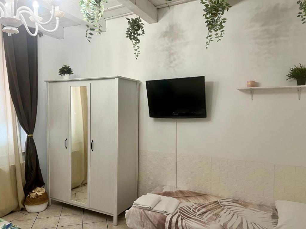 TV a/nebo společenská místnost v ubytování Verona Rooms