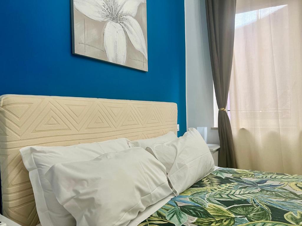 Postel nebo postele na pokoji v ubytování Verona Rooms