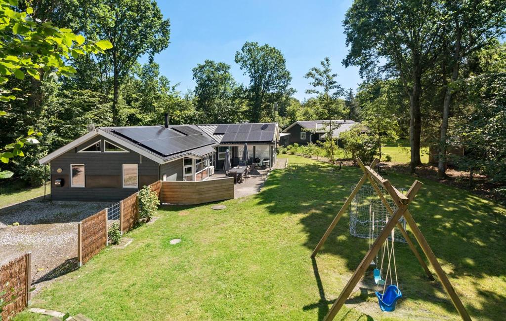 an aerial view of a house with a yard at Nice Home In Glesborg With Sauna in Fjellerup Strand