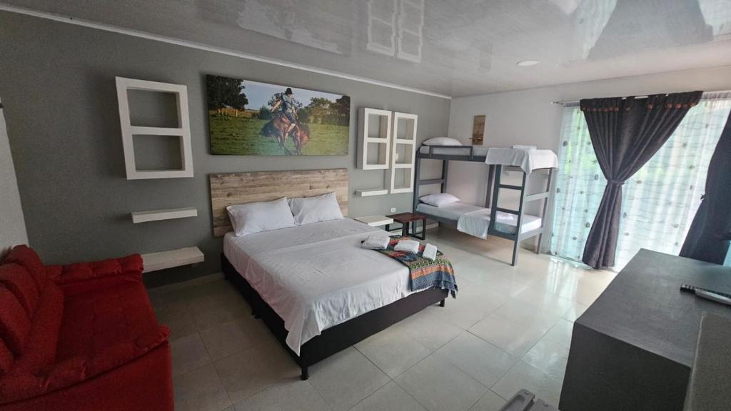 Voodi või voodid majutusasutuse Hotel - Rancho JJ toas